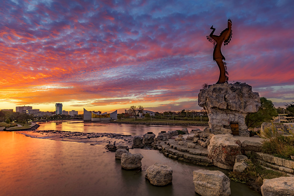 Rock formations line the water in Wichita at dusk