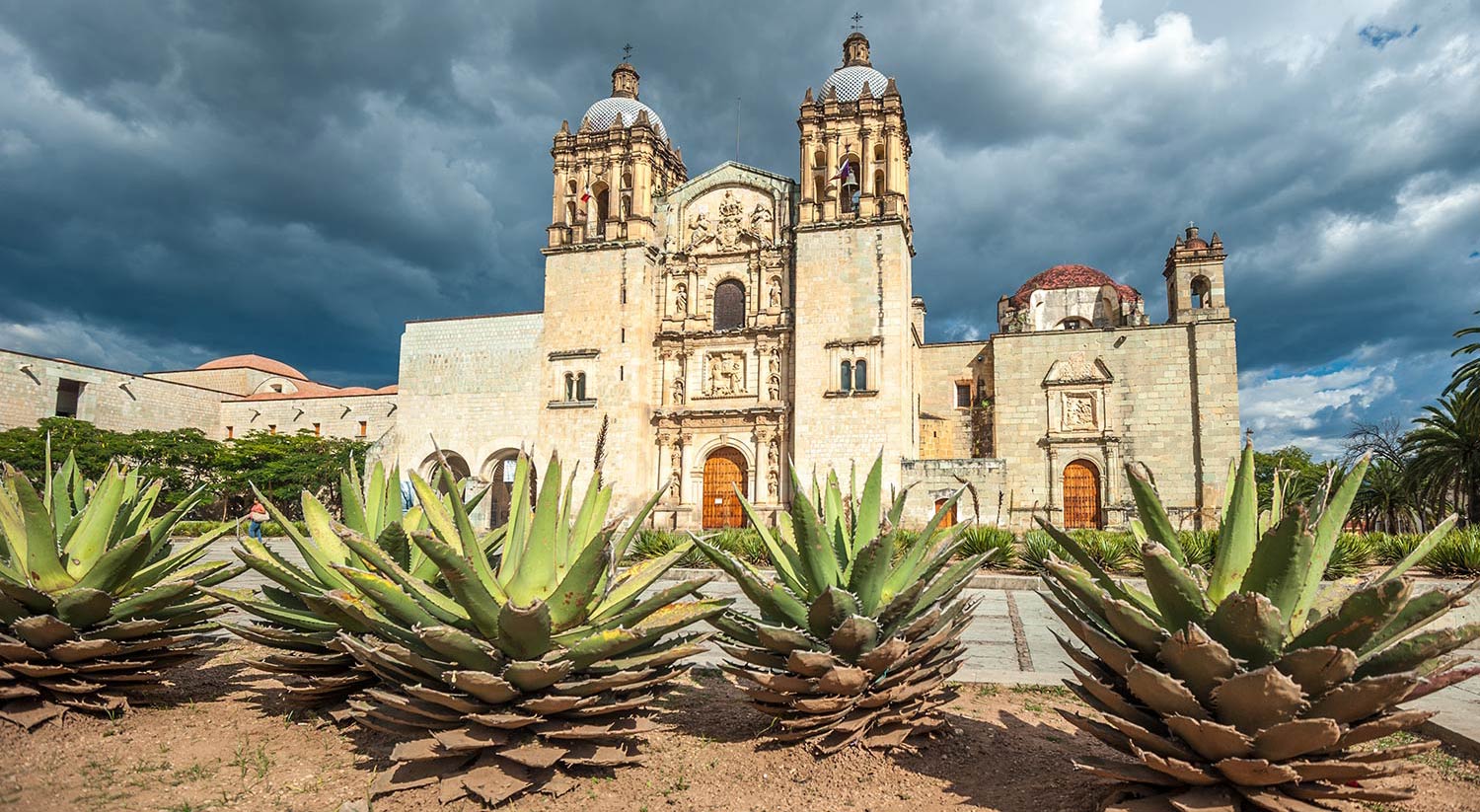 Dark storm clouds loom over a building in Oaxaca
