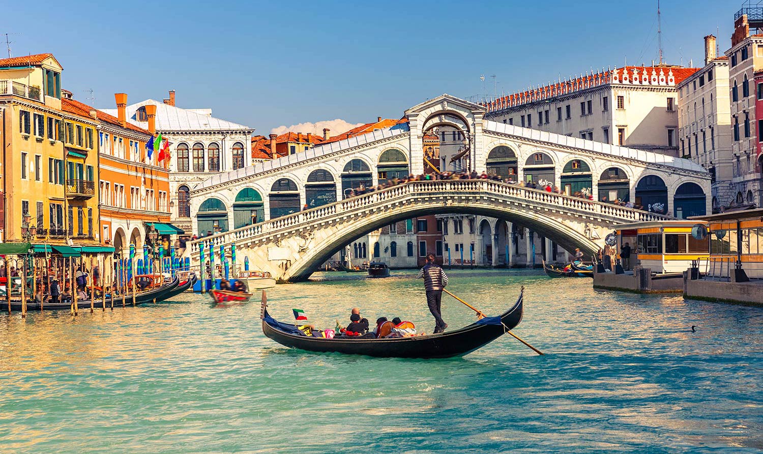 A lone gondola floats on a Venice canal